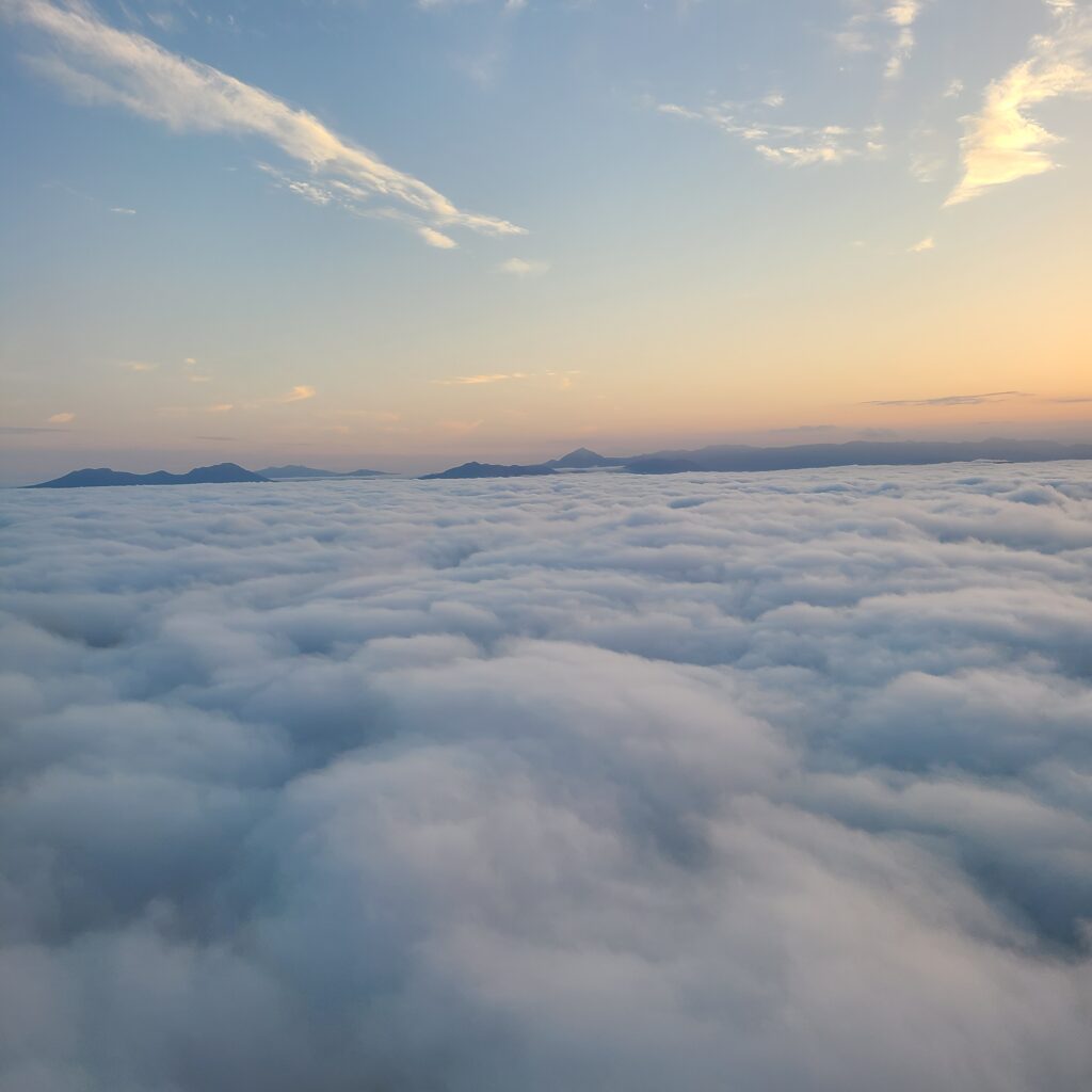 Hokkaido above clouds with sunset