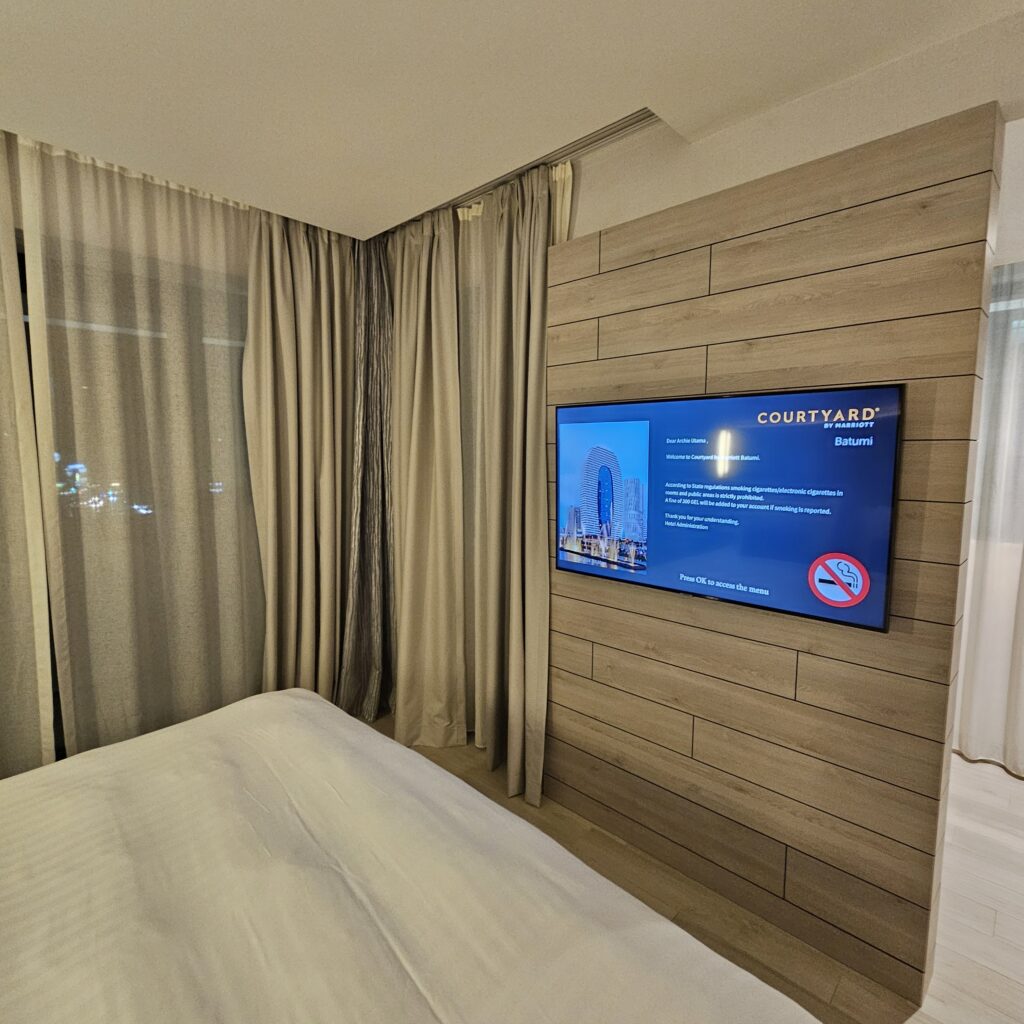 Courtyard Batumi King Suite Bedroom TV